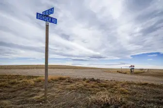 U.S. Shuts Historic Border Road to Canadian Traffic (Locals Call Decision ‘Ridiculous’) A little-known but historic road connecting communities near the Canada–U.S. border is being closed to Canadian traffic, sparking frustration among residents on both sides of the border. Officials from the United States Customs and Border Protection confirmed that access to the small border crossing road will be restricted, meaning Canadian drivers will no longer be able to use the route to enter the United States. The decision affects a narrow stretch often referred to as “Border Road,” a historic local access route used for decades by residents in nearby communities in Quebec and the U.S. state of Vermont. A Road With Deep Local History For years, the road served as a convenient shortcut for people living near the border. Farmers, local workers, and families frequently used it for quick trips between nearby towns. Although it was never a major commercial crossing, it had symbolic importance for communities where the international border runs directly through rural neighborhoods. Residents say the road reflected the long-standing cooperation between the United States and Canada, two countries that share one of the world’s longest peaceful borders. Why the Road Is Being Closed U.S. authorities say the closure is part of broader efforts to strengthen border security and better manage unofficial crossings. Smaller roads like this often lack permanent customs facilities or full security infrastructure, making them difficult to monitor. By restricting access, officials believe they can focus resources on larger, officially staffed border checkpoints. Local Residents Push Back The decision has sparked criticism from people who live nearby. Some residents say the move feels unnecessary and disruptive for communities that have used the route responsibly for generations. One local resident described the closure bluntly, calling it “ridiculous” and arguing that it complicates everyday travel for people who simply need to cross the border for work, shopping, or visiting family. Others worry the closure could weaken the close ties that have long existed between border towns in Vermont and Quebec. Small Change, Big Symbol While the road itself may be small, the debate surrounding its closure highlights a larger issue: balancing border security with the daily realities of communities that live along the international boundary. For residents in these towns, the border is not just a political line on a map — it is part of everyday life. Now, with the road closing to Canadian traffic, locals say a small but meaningful connection between the two countries is disappearing. For latest Bollywood, cricket and global updates please follow us.